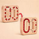 Wooden puzzle game with rotating pieces