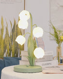 Table lamp featuring a bell orchid